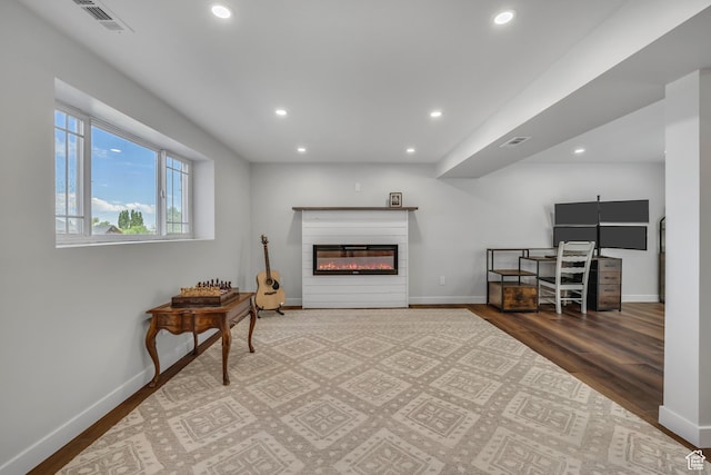 26 N 325 E, Farmington, UT 84025 - sitting room featuring recessed lighting, wood finished floors, and a glass covered fireplace