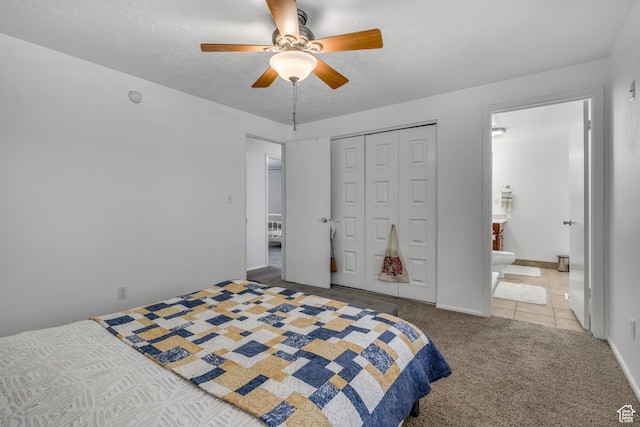 26 N 325 E, Farmington, UT 84025 - carpeted bedroom featuring a closet, ceiling fan, ensuite bath, and tile patterned flooring