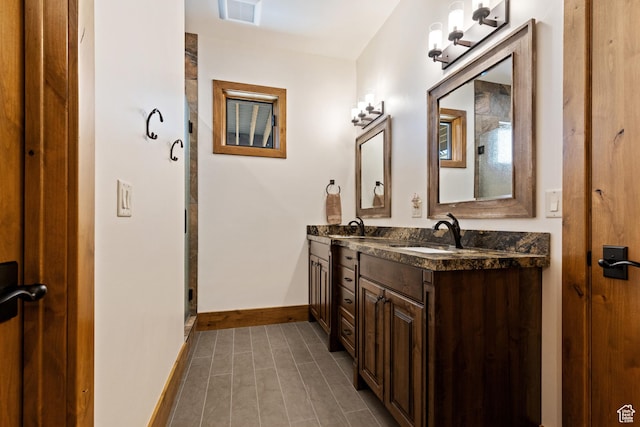 3911 N Zermatt St, Eden, UT 84310 - full bath with double vanity, tile patterned flooring, and an enclosed shower