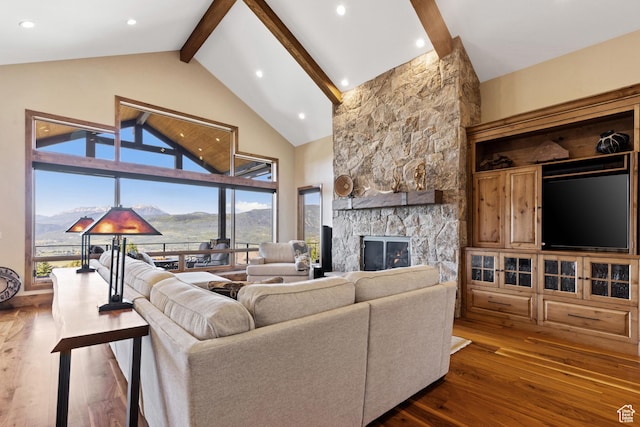 3911 N Zermatt St, Eden, UT 84310 - living area with beam ceiling, dark wood-type flooring, a fireplace, high vaulted ceiling, and recessed lighting