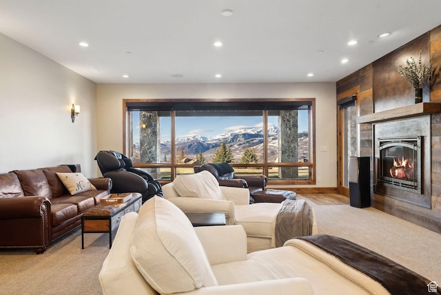 3911 N Zermatt St, Eden, UT 84310 - living room with recessed lighting, light carpet, a glass covered fireplace, and a mountain view