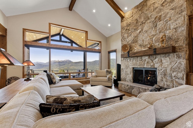 3911 N Zermatt St, Eden, UT 84310 - living room featuring a mountain view, beamed ceiling, a stone fireplace, high vaulted ceiling, and wood finished floors