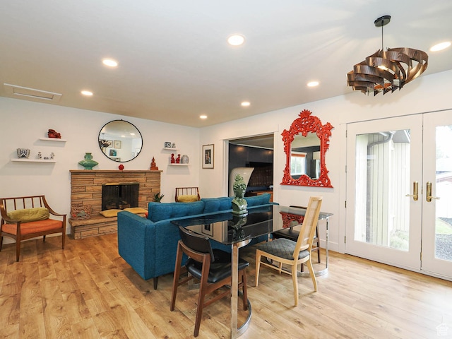 4601 S Creekview Cir, Murray, UT 84107 - living room featuring light wood finished floors, recessed lighting, a stone fireplace, and a chandelier
