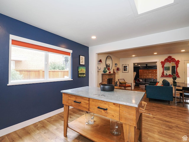 4601 S Creekview Cir, Murray, UT 84107 - kitchen featuring light wood-type flooring, a fireplace, and recessed lighting