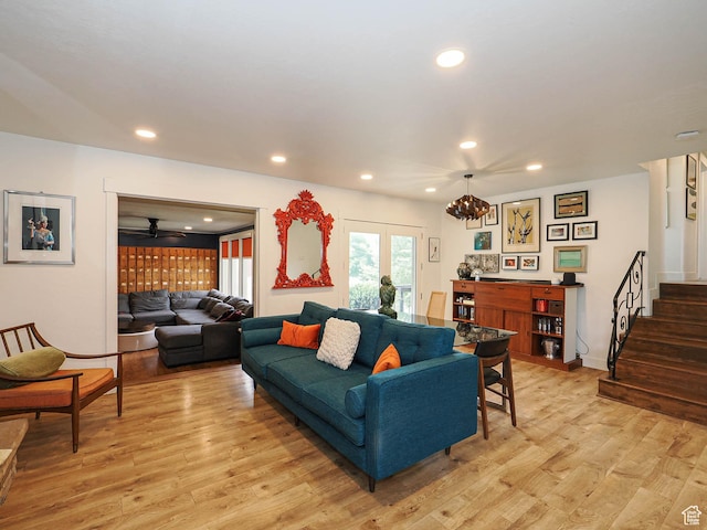 4601 S Creekview Cir, Murray, UT 84107 - living area with light wood-type flooring, stairs, recessed lighting, and a chandelier