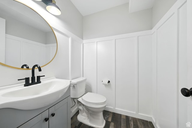 3474 W 7520 S, West Jordan, UT 84084 - bathroom featuring a decorative wall, vanity, wood finished floors, and wainscoting