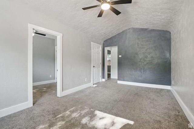 2973 Adams Ave, Ogden, UT 84403 - unfurnished bedroom featuring carpet flooring, lofted ceiling, a ceiling fan, and a textured ceiling