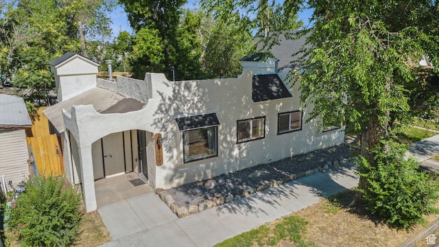 2973 Adams Ave, Ogden, UT 84403 - view of front of property featuring stucco siding and a chimney