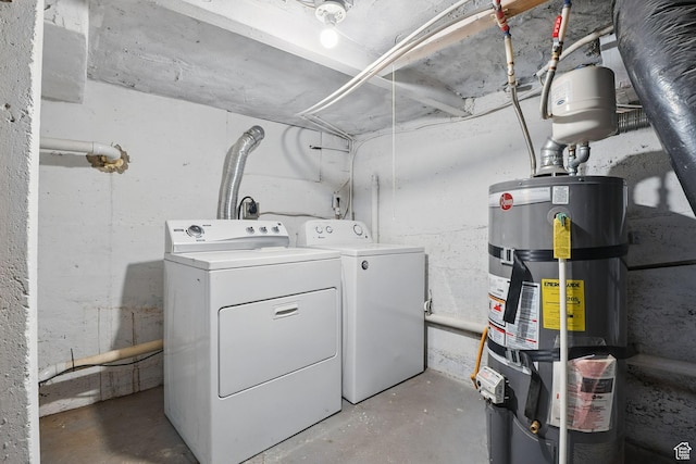 2973 Adams Ave, Ogden, UT 84403 - washroom featuring secured water heater and washer and dryer