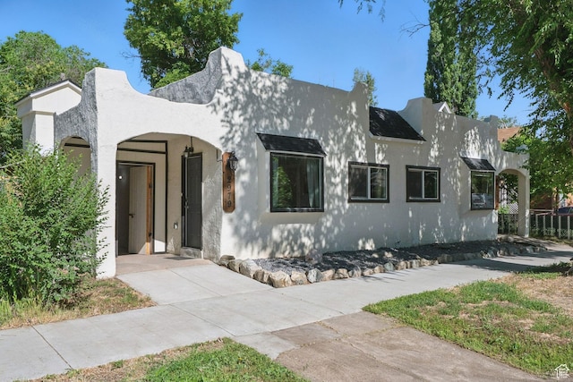 2973 Adams Ave, Ogden, UT 84403 - view of front of home featuring stucco siding and driveway