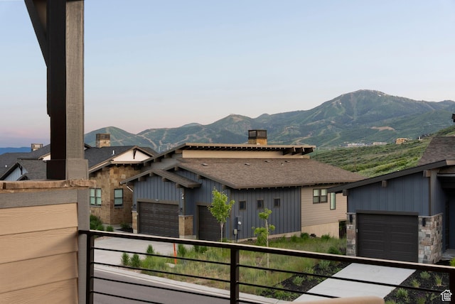 12756 N Belaview Way, Hideout, UT 84036 - view of front of property featuring a balcony, a mountain view, a chimney, roof with shingles, and board and batten siding