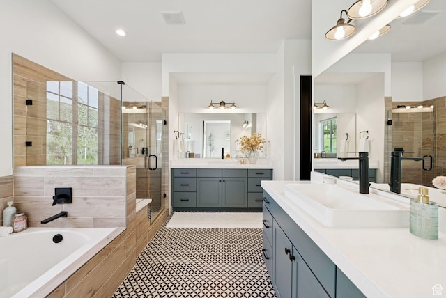 12756 N Belaview Way, Hideout, UT 84036 - full bathroom with a stall shower, two vanities, a bath, and tile patterned floors