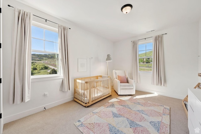 12756 N Belaview Way, Hideout, UT 84036 - carpeted bedroom with baseboards and a crib