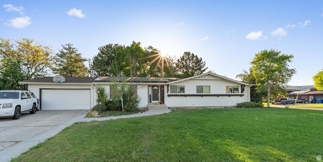 785 N 200 E, Tremonton, UT 84337 - ranch-style home featuring an attached garage, a front yard, roof mounted solar panels, and concrete driveway