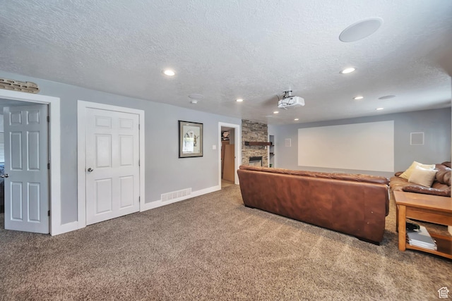 1295 S 4050 W, Syracuse, UT 84075 - carpeted cinema room featuring a stone fireplace, a textured ceiling, and recessed lighting