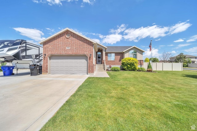 1295 S 4050 W, Syracuse, UT 84075 - view of front of home with brick siding, concrete driveway, and a garage