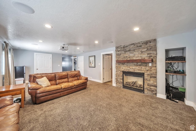 1295 S 4050 W, Syracuse, UT 84075 - living area featuring carpet floors, a textured ceiling, recessed lighting, and a stone fireplace