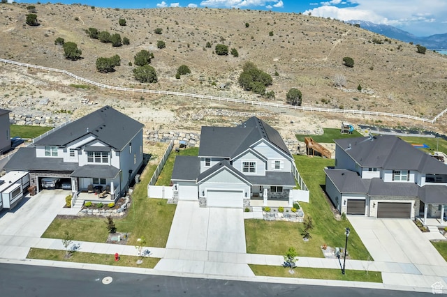 7366 N Golden Summit Dr, Eagle Mountain, UT 84005 - aerial perspective of suburban area with a mountainous background and a desert landscape