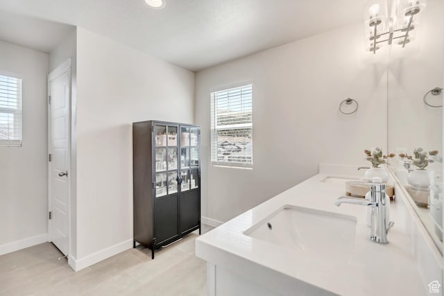 7366 N Golden Summit Dr, Eagle Mountain, UT 84005 - full bath featuring double vanity, a chandelier, and tile patterned flooring