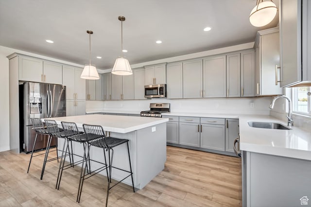 7366 N Golden Summit Dr, Eagle Mountain, UT 84005 - kitchen with appliances with stainless steel finishes, gray cabinetry, and recessed lighting