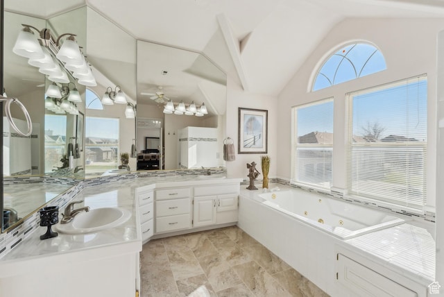 11694 S Stone Crest Cir W, Riverton, UT 84065 - full bathroom with vaulted ceiling, a jetted tub, vanity, and a ceiling fan