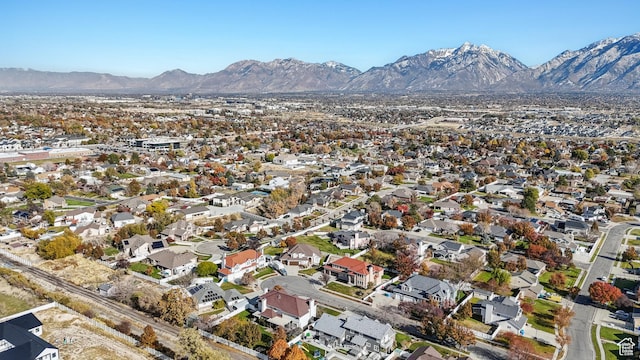 11694 S Stone Crest Cir W, Riverton, UT 84065 - aerial overview of property's location featuring a mountain backdrop and nearby suburban area
