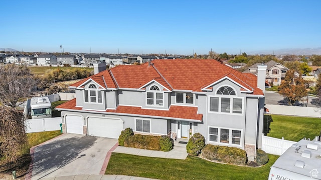 11694 S Stone Crest Cir W, Riverton, UT 84065 - multi unit property with concrete driveway, a residential view, an attached garage, a tile roof, and stucco siding