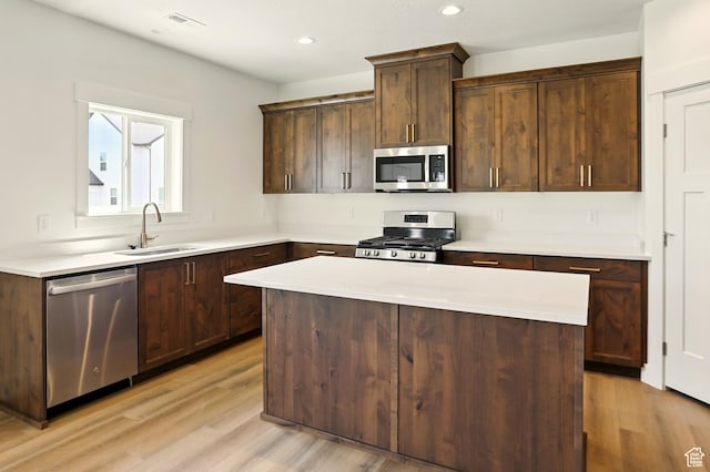 1154 E 1150 S, Garland, UT 84312 - kitchen featuring stainless steel appliances, light wood-style floors, a center island, light countertops, and recessed lighting