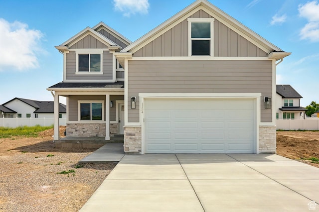 1154 E 1150 S, Garland, UT 84312 - craftsman-style home with board and batten siding, stone siding, covered porch, driveway, and an attached garage