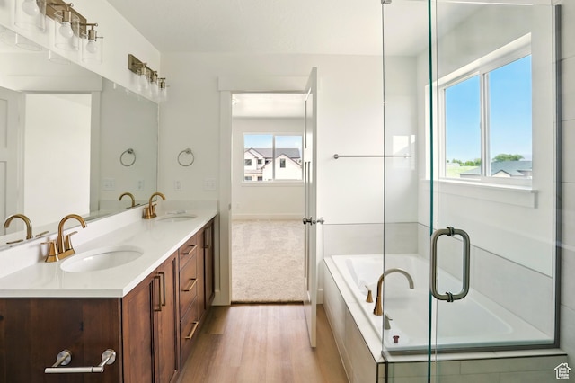 1154 E 1150 S, Garland, UT 84312 - full bath featuring double vanity, a garden tub, and wood finished floors