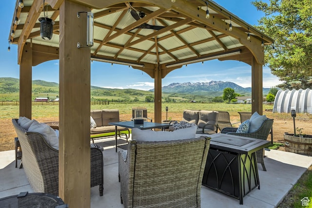 8695 E 800 S, Huntsville, UT 84317 - view of patio with an outdoor living space, a mountain view, and a view of rural / pastoral area