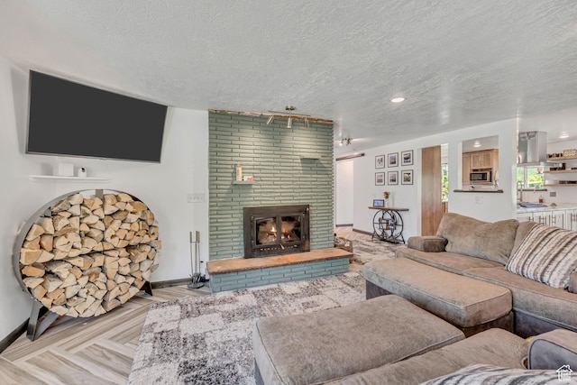 8695 E 800 S, Huntsville, UT 84317 - living room featuring a textured ceiling and a fireplace