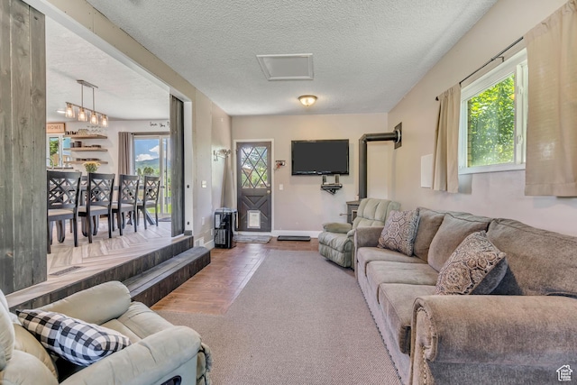 8695 E 800 S, Huntsville, UT 84317 - living area featuring plenty of natural light, a textured ceiling, and carpet flooring