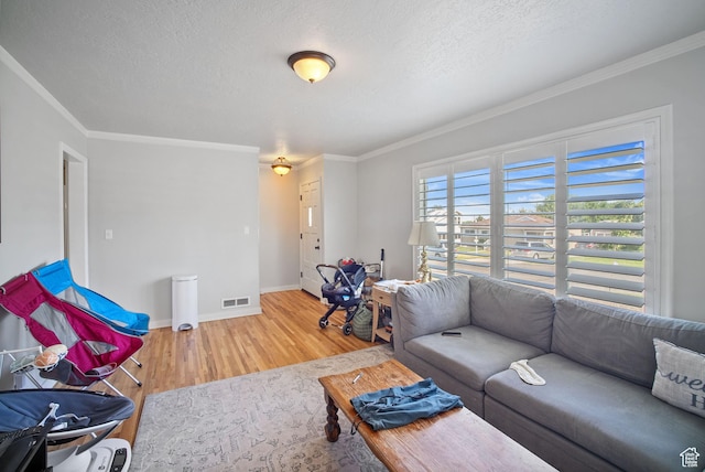 733 W 3500 S, Bountiful, UT 84010 - living area with wood finished floors, a textured ceiling, and ornamental molding