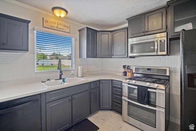 733 W 3500 S, Bountiful, UT 84010 - kitchen with stainless steel appliances, tasteful backsplash, light countertops, crown molding, and a textured ceiling