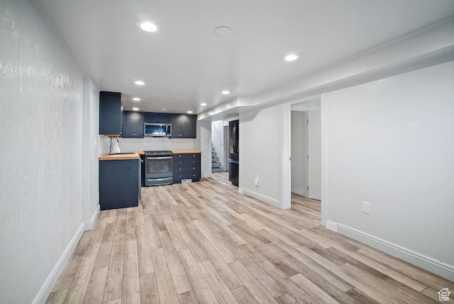 733 W 3500 S, Bountiful, UT 84010 - unfurnished living room with light wood finished floors, recessed lighting, and stairway