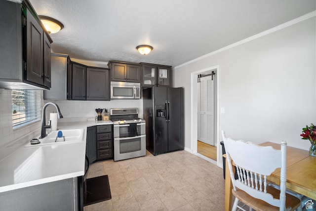 733 W 3500 S, Bountiful, UT 84010 - kitchen featuring appliances with stainless steel finishes, light countertops, crown molding, backsplash, and glass insert cabinets