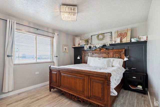 2536 S Andover St, West Haven, UT 84401 - bedroom with light wood-style floors and a textured ceiling