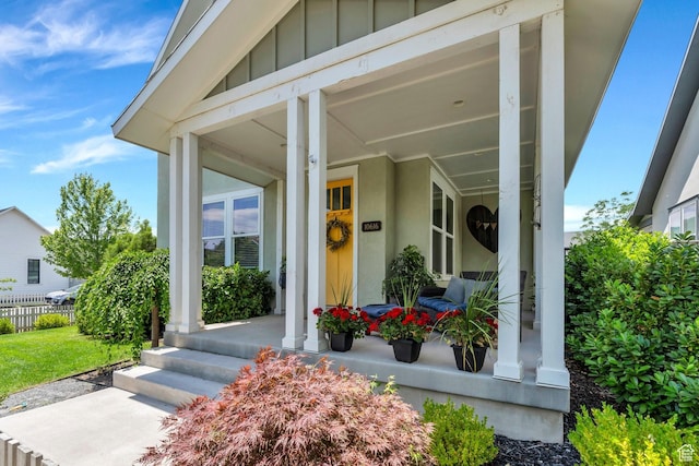 10616 S Wistful Way S, Jordan, UT 84009 - view of exterior entry featuring covered porch and board and batten siding