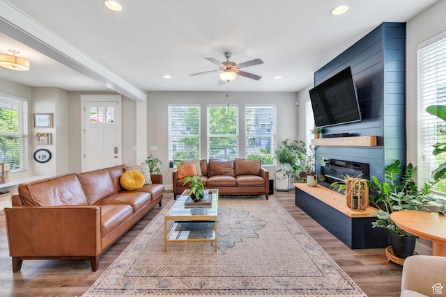 10616 S Wistful Way S, Jordan, UT 84009 - living room with wood finished floors, ceiling fan, a fireplace, and recessed lighting
