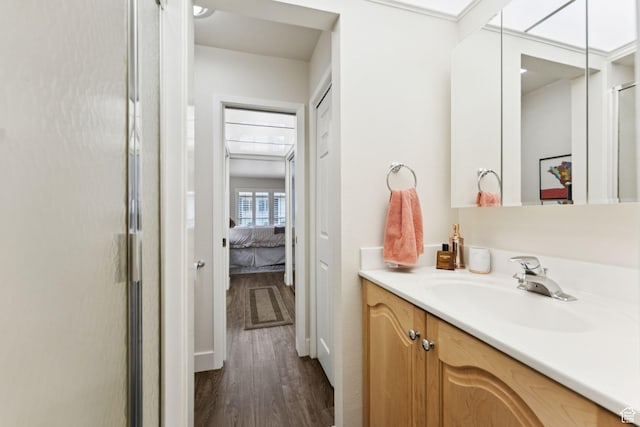 4178 S 650 E, Murray, UT 84107 - bathroom featuring vanity, wood finished floors, connected bathroom, and a stall shower