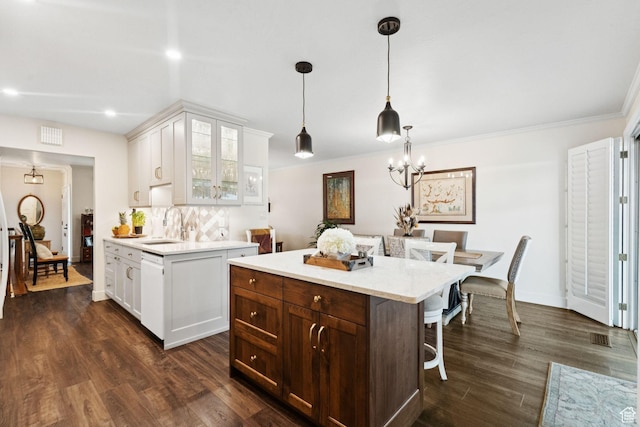 4178 S 650 E, Murray, UT 84107 - kitchen featuring light countertops, glass insert cabinets, a breakfast bar area, dishwasher, and recessed lighting