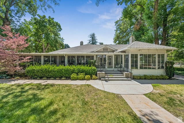 4178 S 650 E, Murray, UT 84107 - back of house featuring a sunroom, a lawn, and a chimney