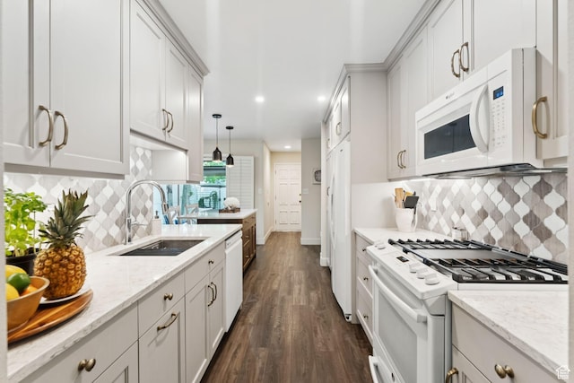 4178 S 650 E, Murray, UT 84107 - kitchen with white appliances, dark wood finished floors, backsplash, light stone countertops, and recessed lighting