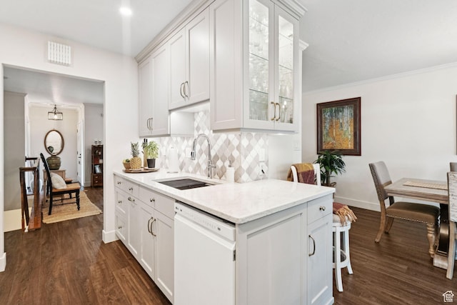4178 S 650 E, Murray, UT 84107 - kitchen featuring white dishwasher, decorative backsplash, dark wood-style flooring, glass insert cabinets, and white cabinetry
