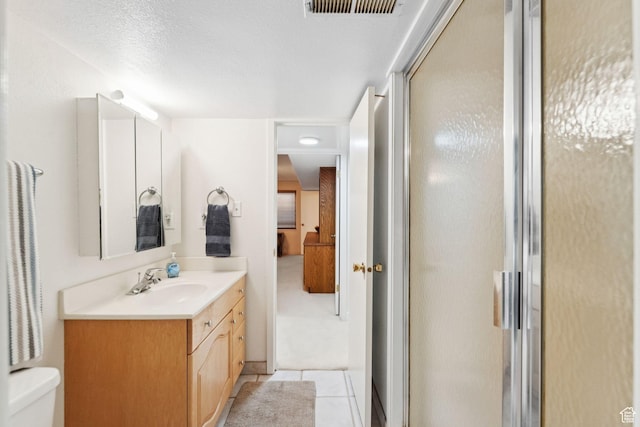 4178 S 650 E, Murray, UT 84107 - bathroom featuring vanity, a stall shower, tile patterned floors, and a textured ceiling