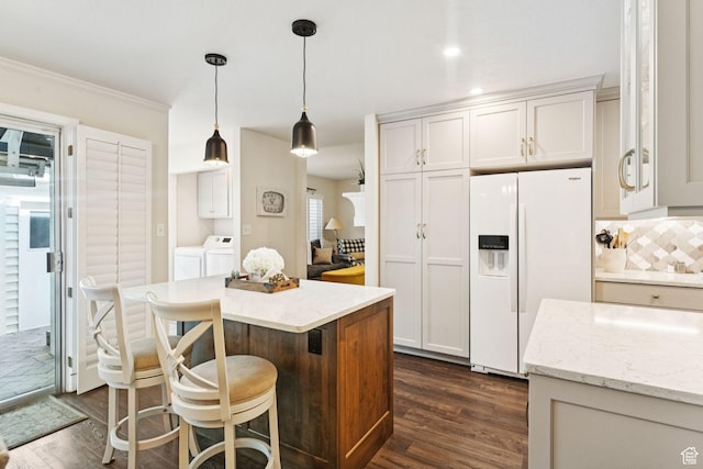 4178 S 650 E, Murray, UT 84107 - kitchen featuring white fridge with ice dispenser, independent washer and dryer, dark wood finished floors, pendant lighting, and crown molding