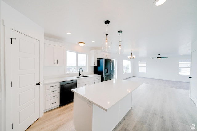 1858 N 515 W, Logan, UT 84341 - kitchen with black appliances, healthy amount of natural light, a kitchen island, and recessed lighting