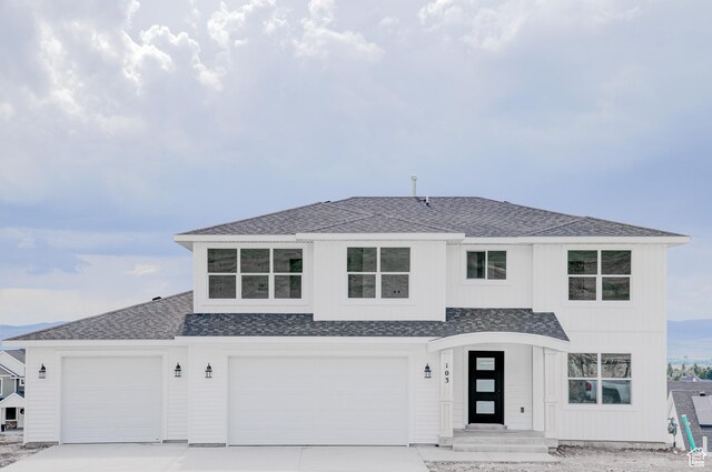 1858 N 515 W, Logan, UT 84341 - view of front facade featuring driveway, roof with shingles, and a garage