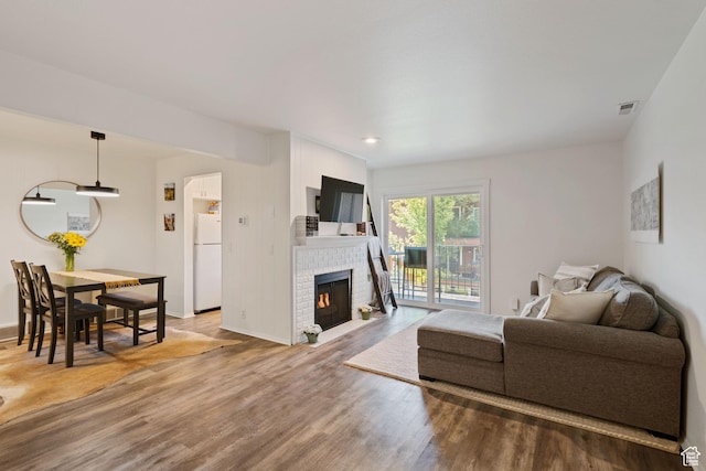 2402 S Elizabeth St Unit 5, Salt Lake City, UT 84106 - living area with wood finished floors, a fireplace, and recessed lighting